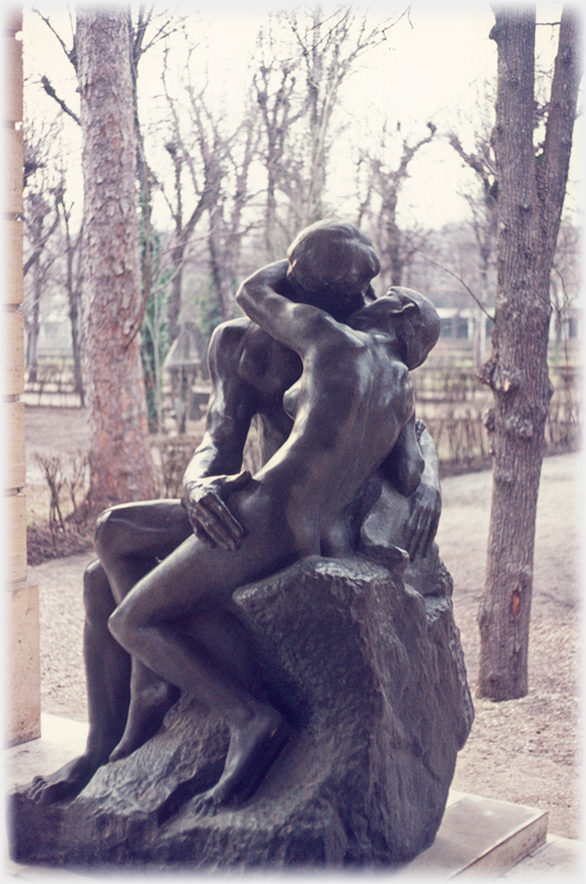 Rodins sculpture of couple in embrass called The Kiss.