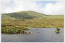 A corner of Loch Skeen with White Coomb rising behind it.