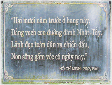 Ho Chi Minh poem etched in gold on black background dated 1961.