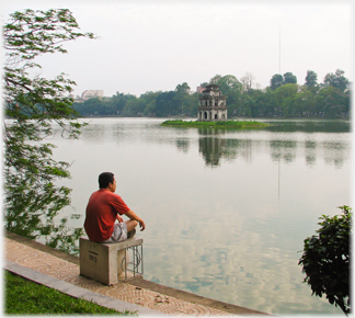 Man sitting by the Lake