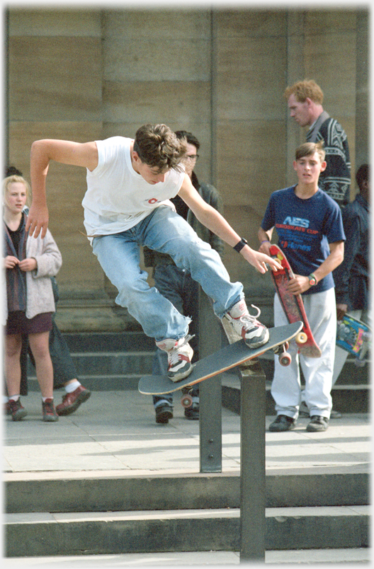 Skate boarder a metre up in the air.
