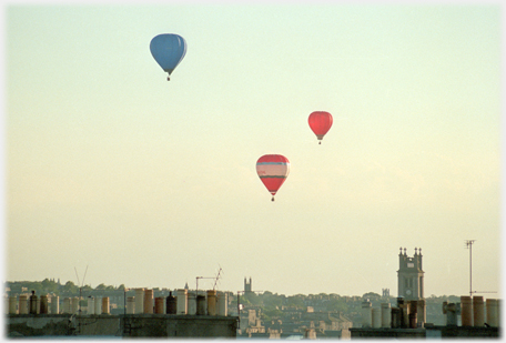 Three balloons over the city.