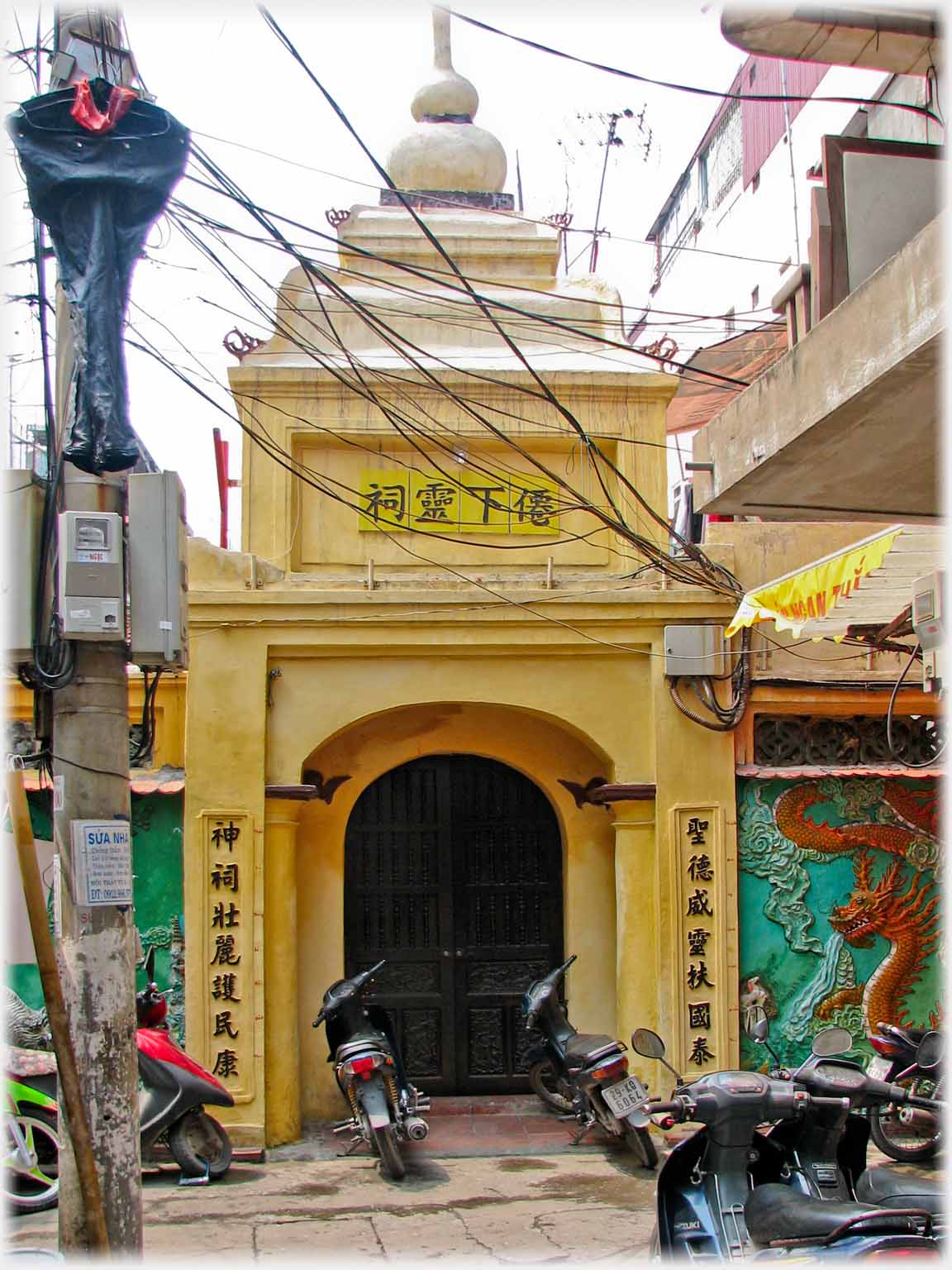 Pagoda entrance with Chinese characters.