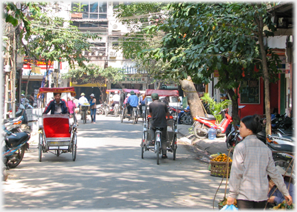 Street wth rickshaws going each way.