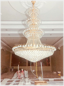 The chandelier into place.
