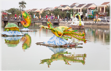 Models of crocodiles on the river