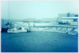 Raufarhofn harbour with snow form inside hotel.