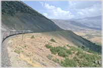 Train wending its way round mountain in eastern Turkey.