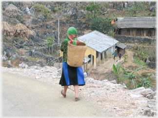 Hmong woman by village.
