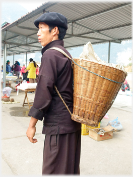 Man with basket and beret.