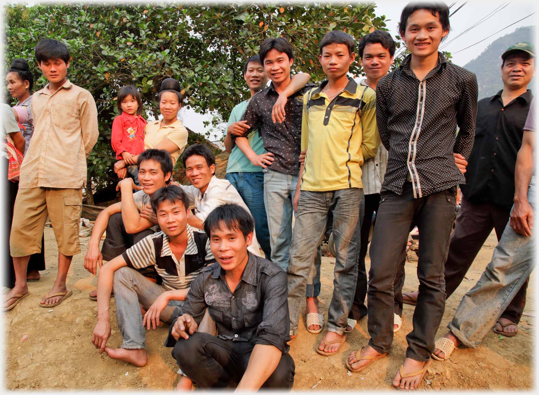 Group of younger men all smilling at camera.