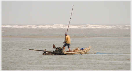 Yellow Fisherman on flat boat