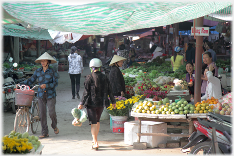 Fruit stalls at entrance.