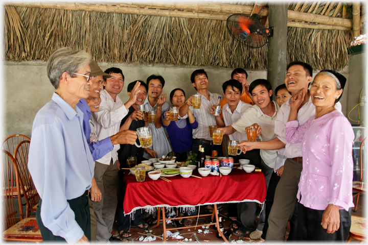 Group holding up glasses in a toast.