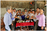 Group of people livily raising their glasses in toast.