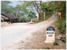 A Vietnames milestone showing zero miles to destination.