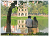 Couple sitting overlooking a lake.