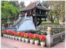 Pagoda on pillar in pool.