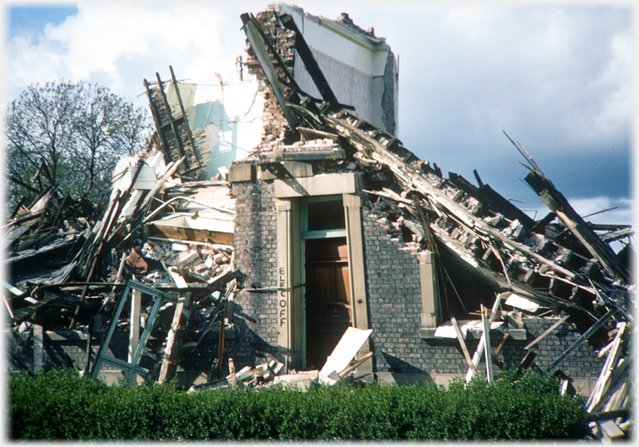 Demolished house with only roor standing.