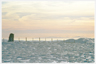 The view from Trowgrain Middle of snow, cairn, clouds and distant hills.