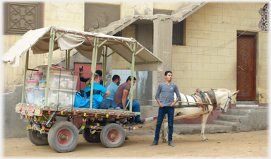 Cart arrived at the village square.