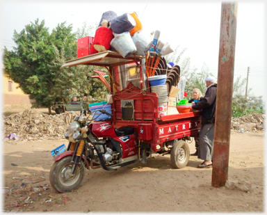 Trader's goods on motorbike.