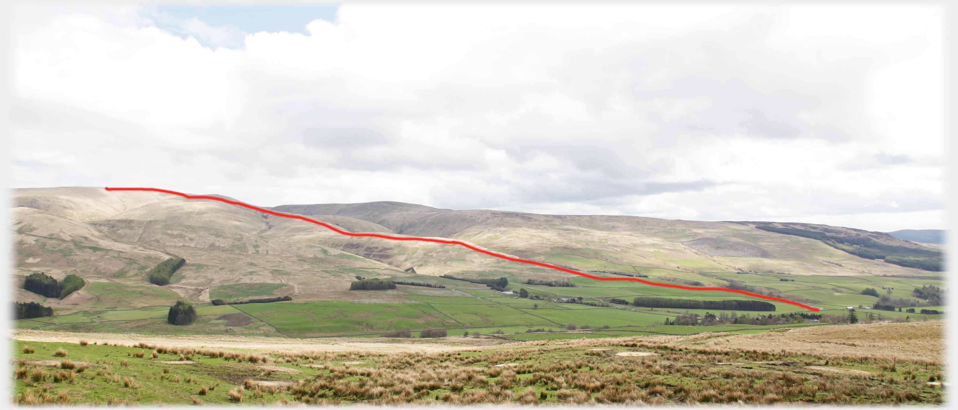 Hills along side of valley with red line running from valley to hilltop.