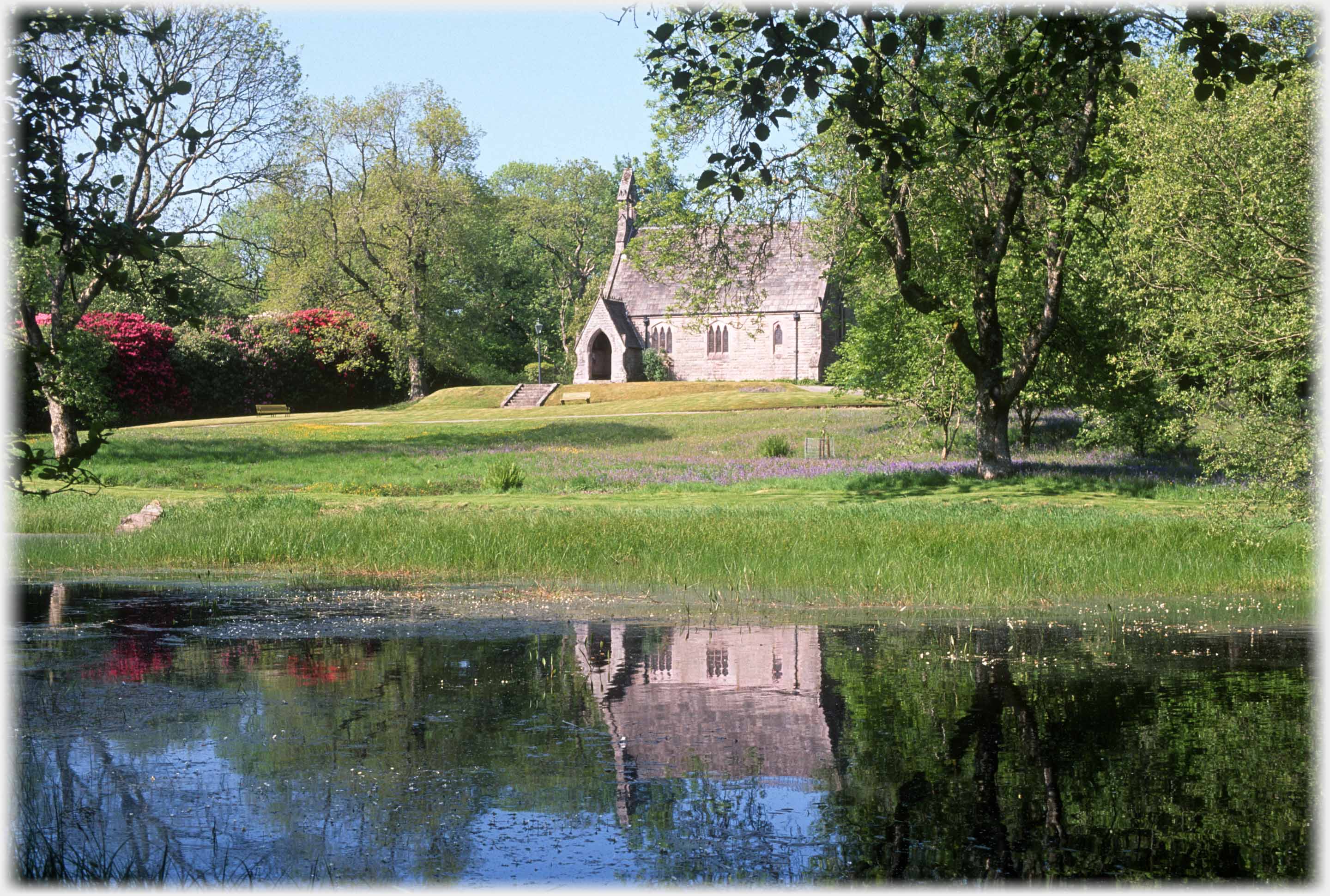 Chapel reflected in lake.