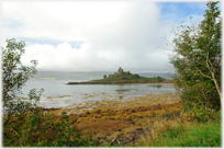 Building on islet in sea.