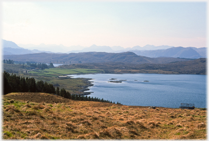 Loch, low land, and hills beyond.