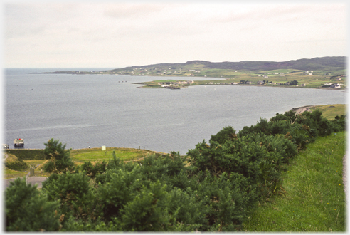 Wider landscape of village on a grey day.