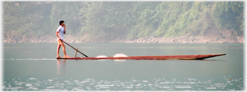 Fisherman standing in his boat.