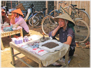 Woman selling nuts.