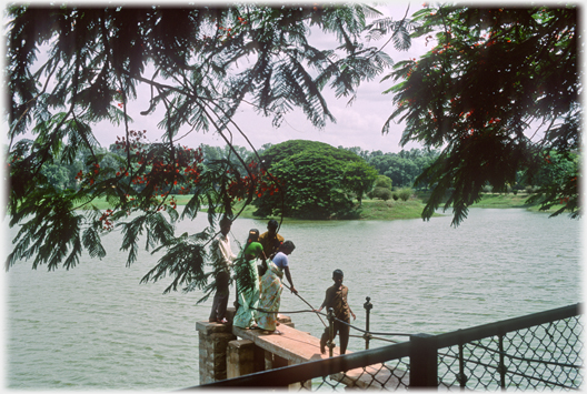 Group on small pier with lake around.