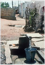 Stand pipe with water flowing.