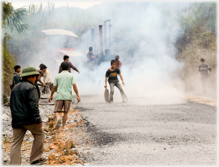 Workers repairing highway 34.