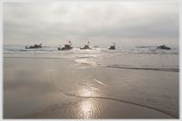 Fishing boats anchored in shallow water near Tinh Gia.