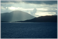 Couds and sun-shafts around Hartaval on Barra.