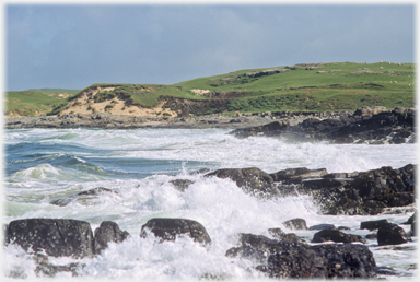 Swell surging into the shore.