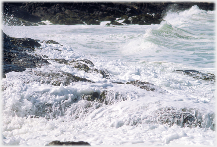 Waves on shore rocks.