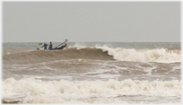 Fishing boat in swell