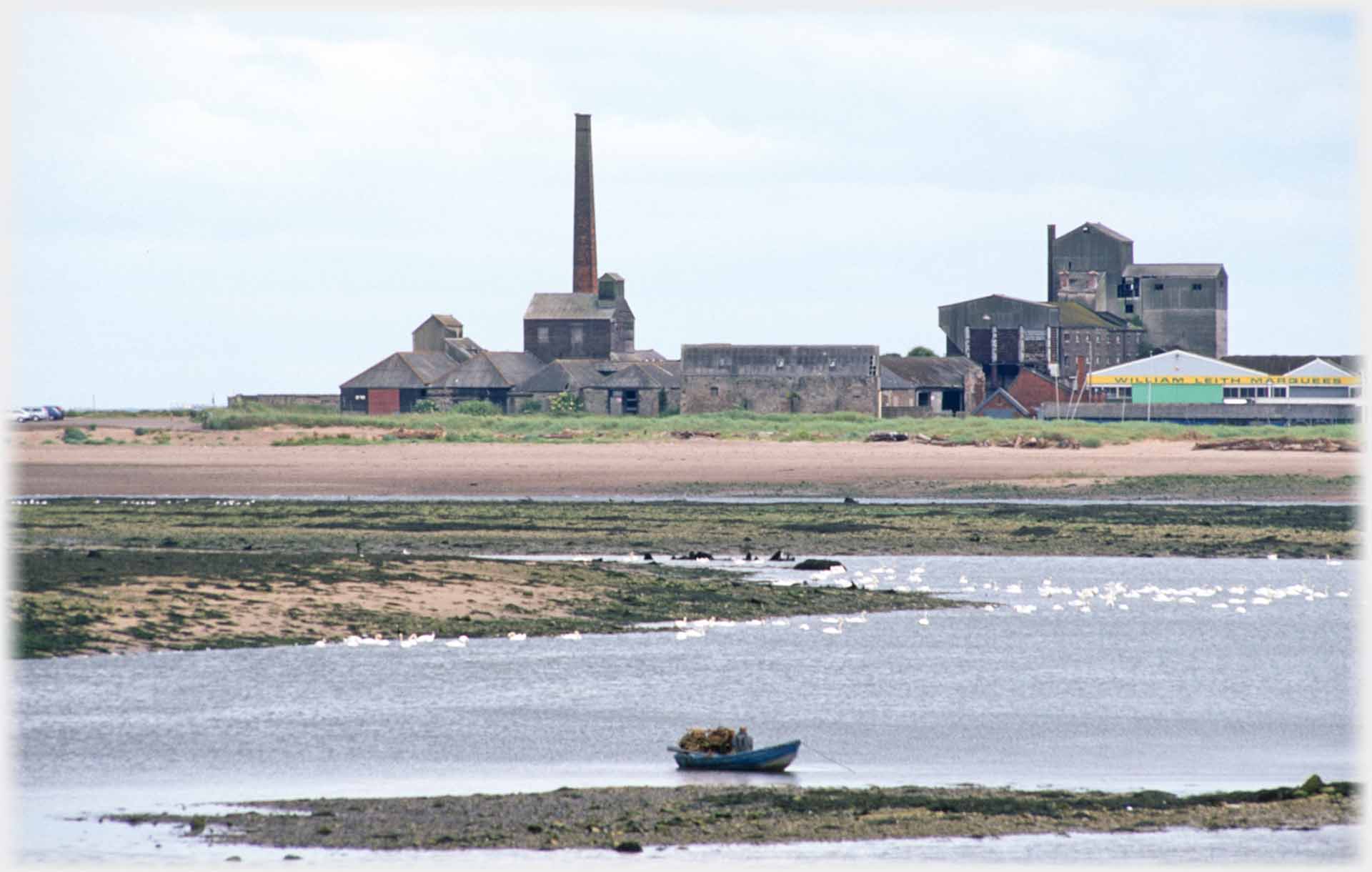 Factory, chimney and boat.