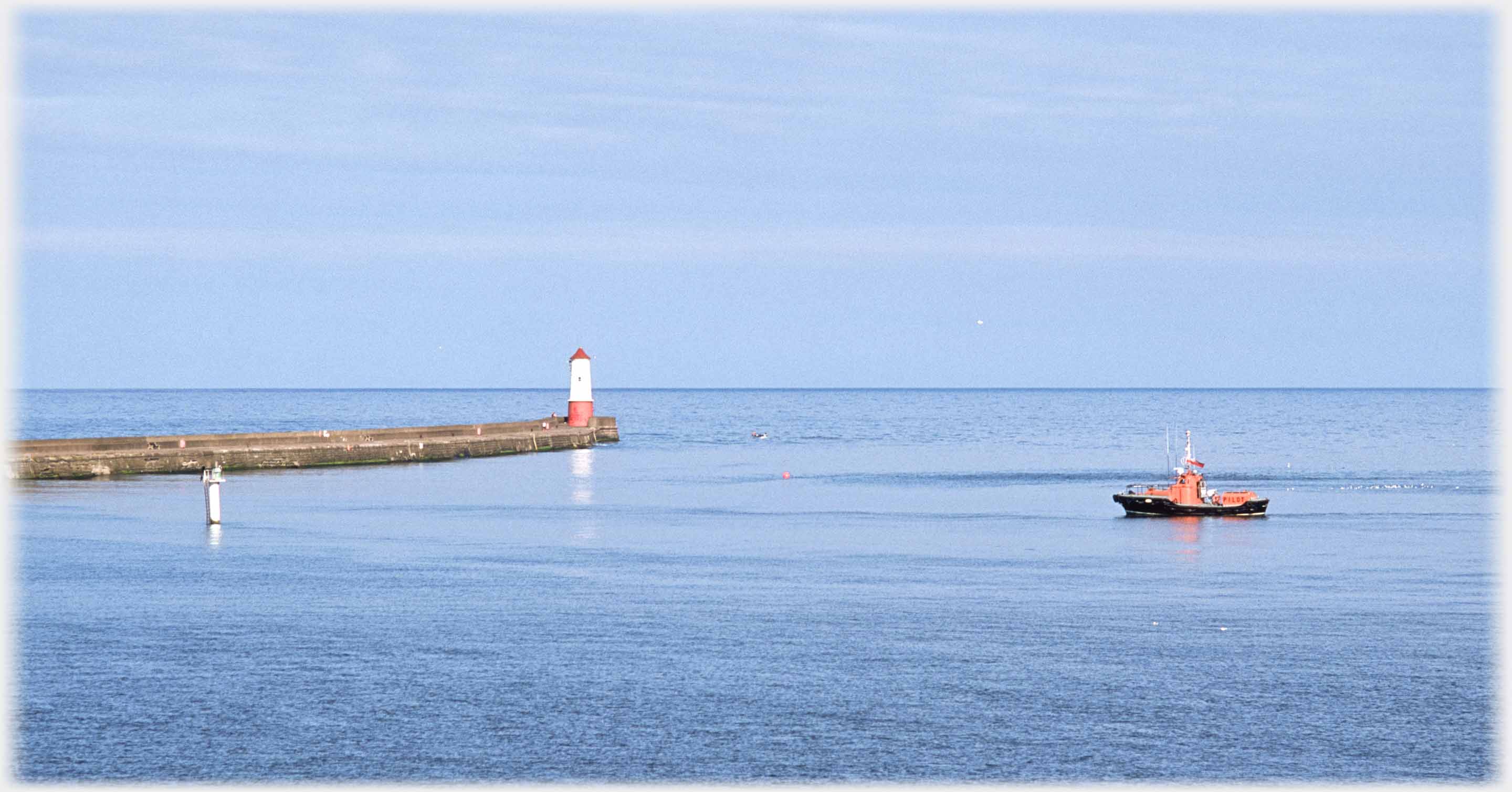 Pier, lighthouse and lifeboat.