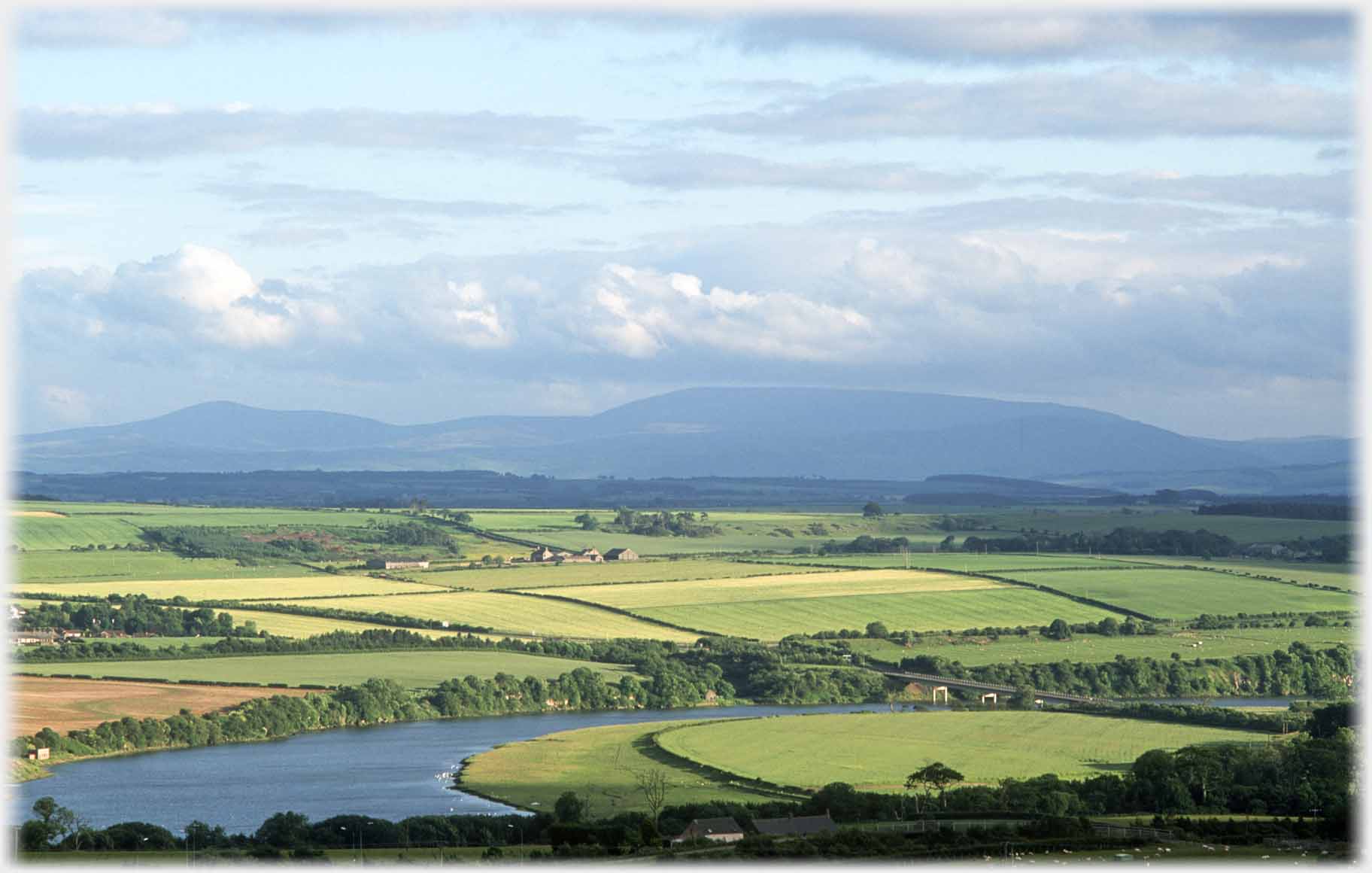 River, fields and distant hills.