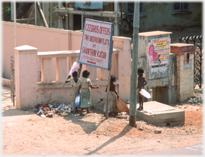 Children by rubbish.