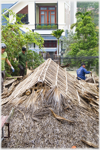 Thatch removed from the main roof.