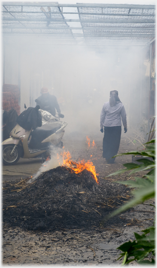 Burning the palm fronds.