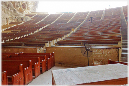 Banks of wooden seating.