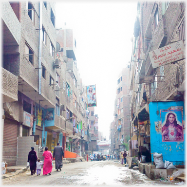 Street with posters of Christ.