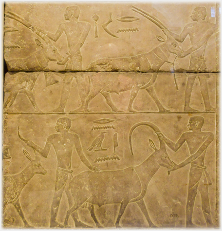 Relief of men tending animals.